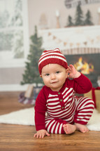 infant in Christmas pajamas 
