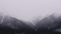 fog over winter mountain peaks 