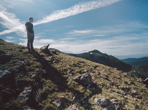 man standing on a mountaintop 
