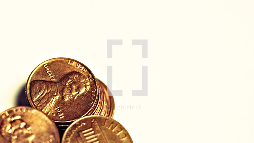 Three stacks of pennies isolated on white
