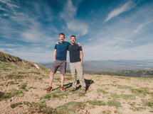 men standing on a mountain top 