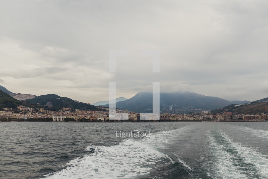 view of coastal cities in Italy and boat trail 