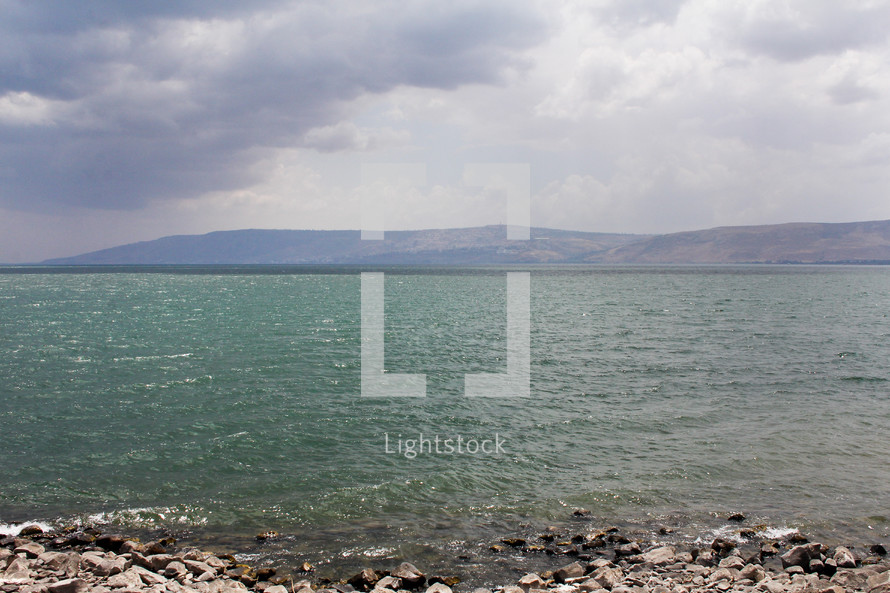 The Sea of Galilee with mountains in the background.