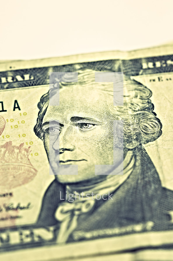 Alexander Hamilton on a ten dollar bill isolated on white