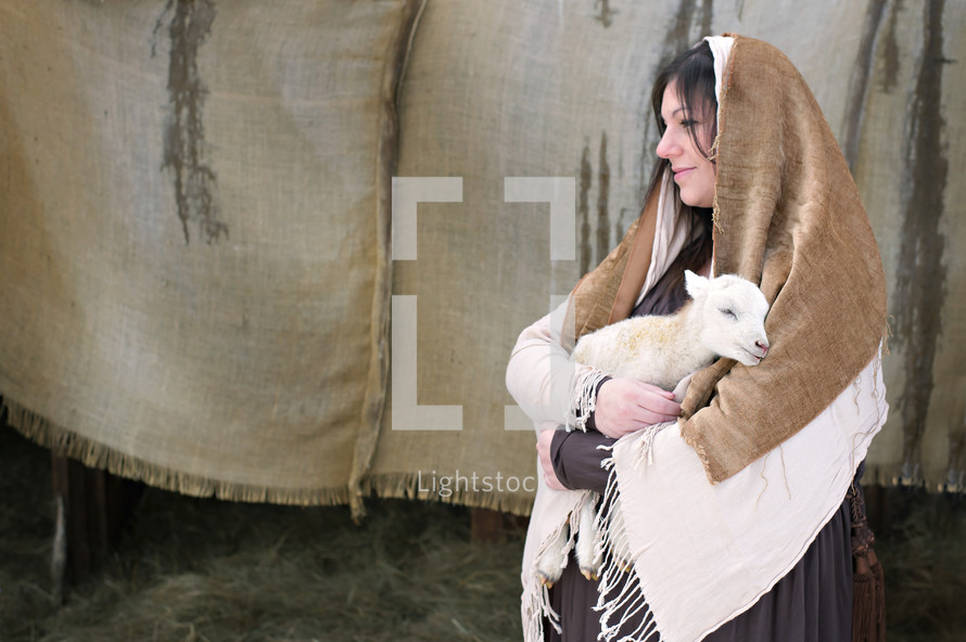 pregnant Mary holding a lamb