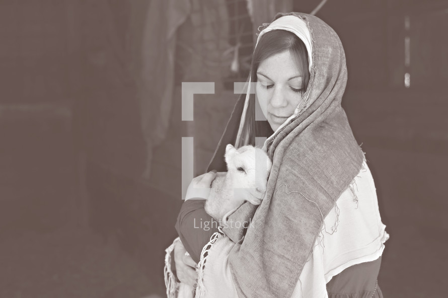 pregnant Mary holding a lamb 