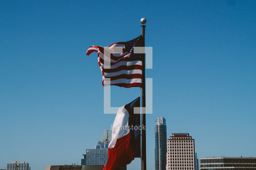 American and Texas flag on a flagpole 