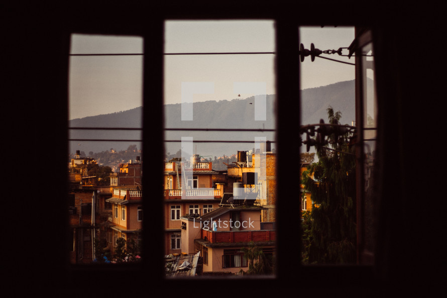 rooftops in Nepal through a window
