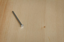 nail on a wood board 