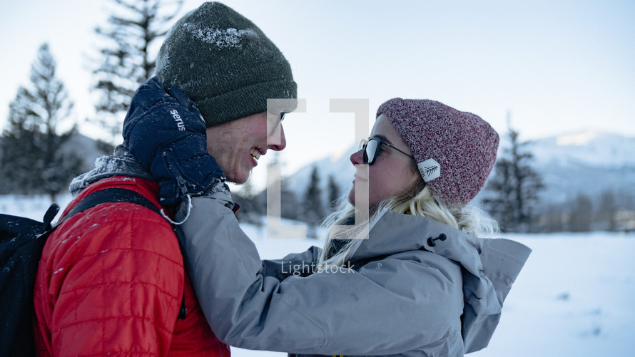 a couple hugging outdoors in winter 