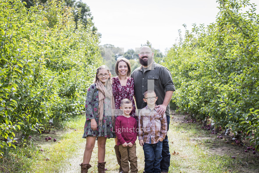 family portrait in an apple orchard 