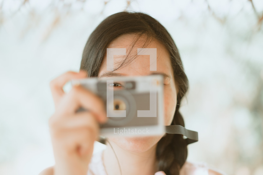 a woman holding a camera 