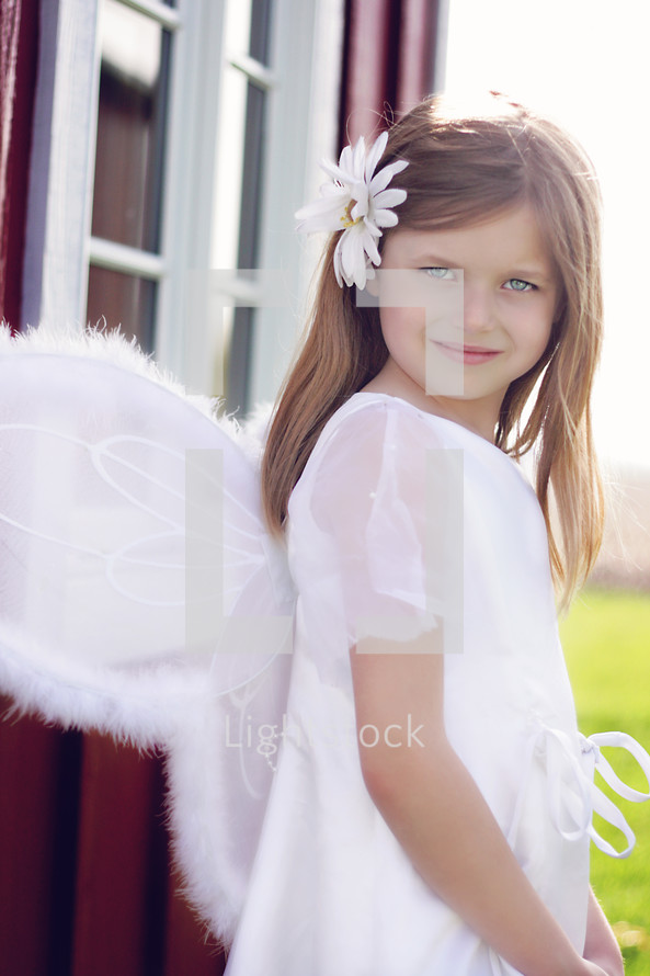 A little girl dressed as an angel 