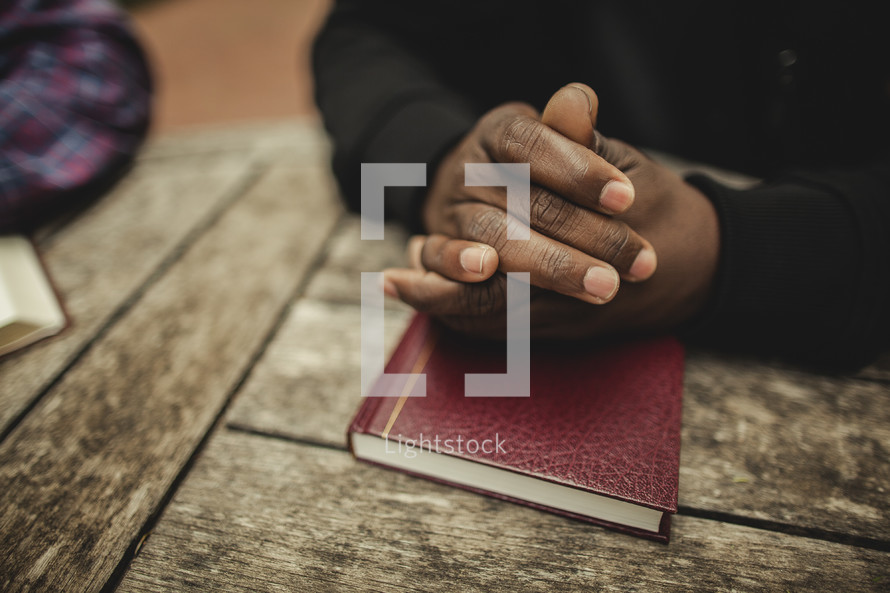 Man  in prayer with bible