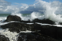 ocean waves slamming into rocks