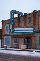 An old movie theater in snow.