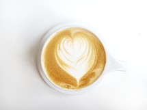 heart shape creamer in a latte