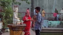 Man worshiping a Hindu idol god at the Taraknath Temple in Kolkata, India. 