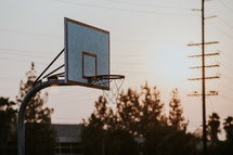 outdoor basketball goal at sunset 
