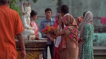 Woman worshiping a Hindu idol god at the Taraknath Temple in Kolkata, India.