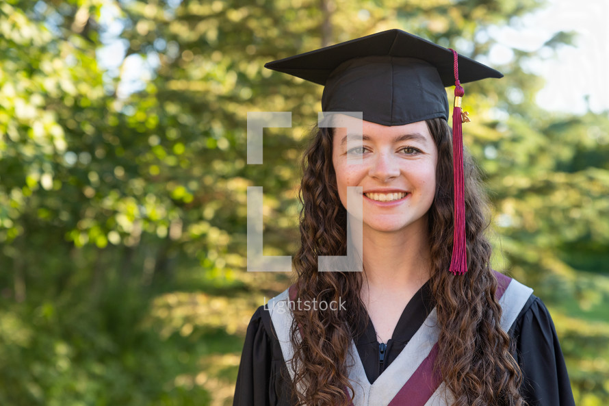 female graduate in cap and gown 
