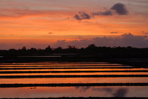 Sunset over a fish farm in Indonesia