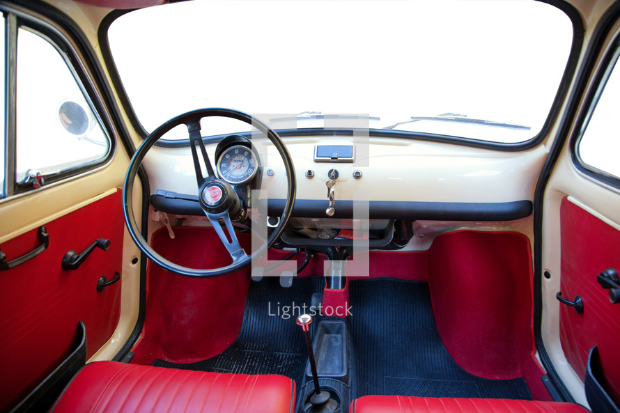 Florence, Italy - January 12, 2012: Vintage Fiat 500 was one of the most produced European. Interior view with customizable windshield and side windows.