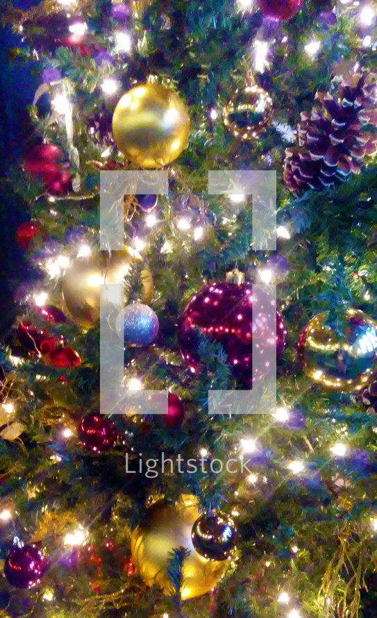Christmas tree decorations Christmas tree ornaments and lights lighting up a Christmas Tree. 