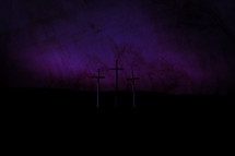 Good Friday crosses against a purple sky
