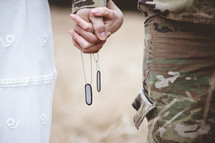 military couple holding hands 