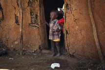 child in a doorway in Africa