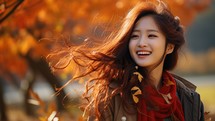 Portrait of a beautiful asian woman smiling in the autumn park