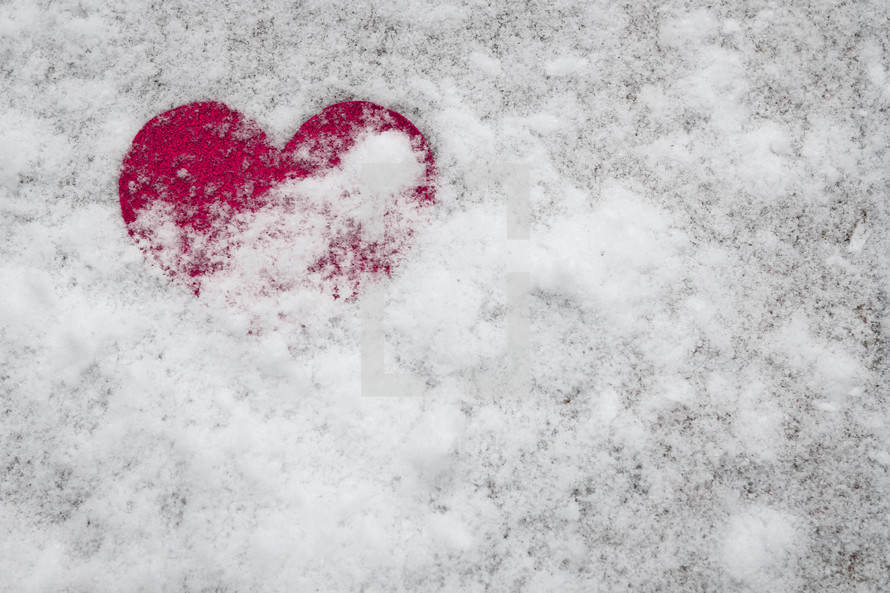 pink heart in snow 