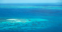 aerial view over coral reefs 