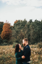 blurry image of a couple hugging 