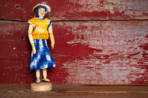 knit clothes on a figurine 