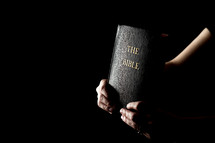 holding a Bible 