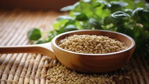 Soybeans in a wooden bowl with basil leaves on the table