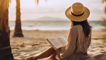 Beautiful asian woman reading book on the beach at sunset time