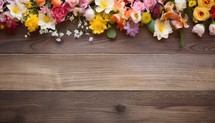 Flowers on wooden background with copy space for text. Top view