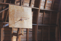 an old basketball hoop in a barn 