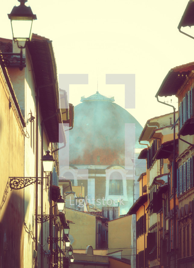 Partial view of Brunelleschi's Dome in Florence. Unusual view in a glimpse of an alley. Photo taken in winter.