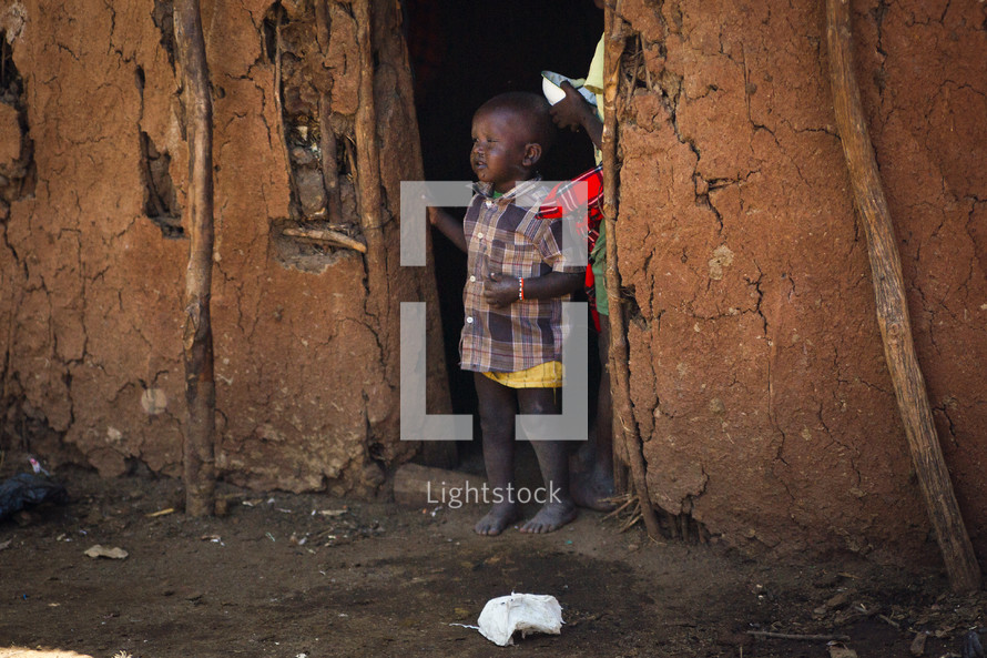 child in a doorway in Africa