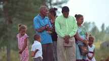 Family praying together in Honduras