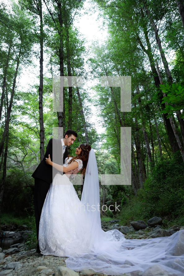 bride and groom standing outdoors 