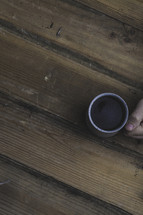 hand holding a coffee mug