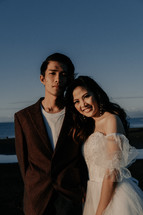portrait of a bride and a groom on a beach 