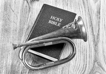 Bible and the brass bugel in black and white.