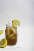 iced tea with lemon in a mason jar 
