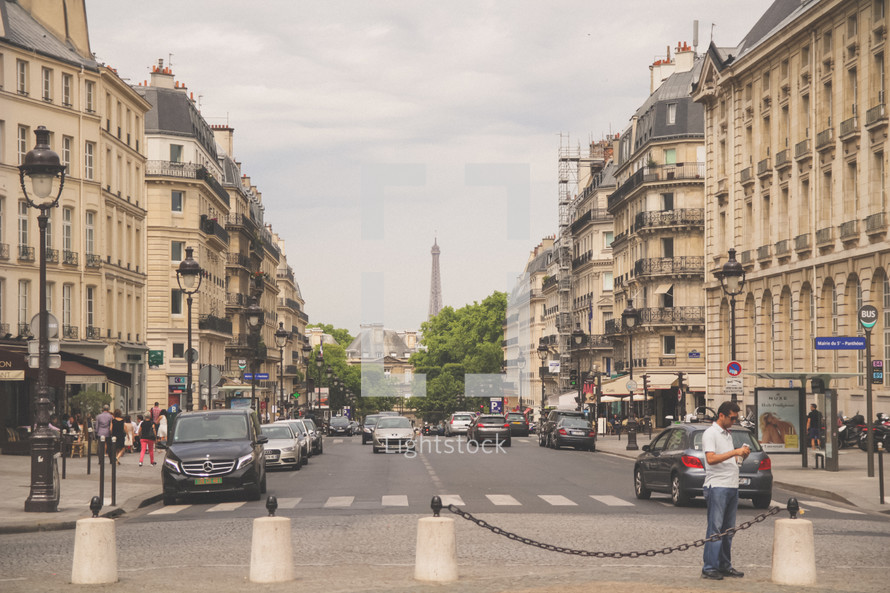 busy streets in Paris and concrete barriers 